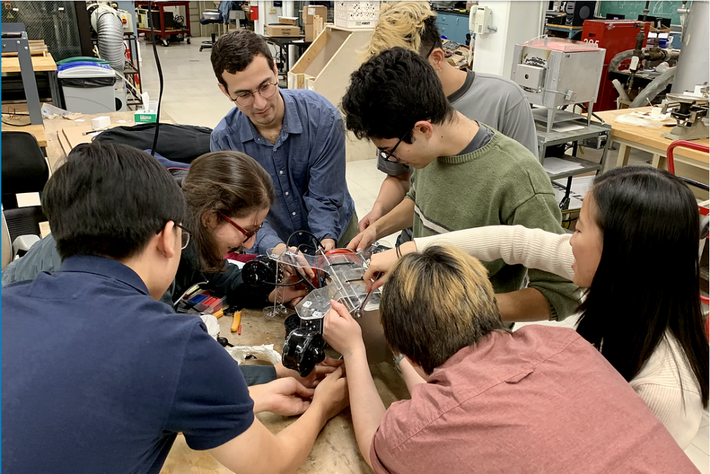 Jonathan Sanabria (center in blue) with other members of the Columbia Robotics Club working on a prototype for an underwater ROV.